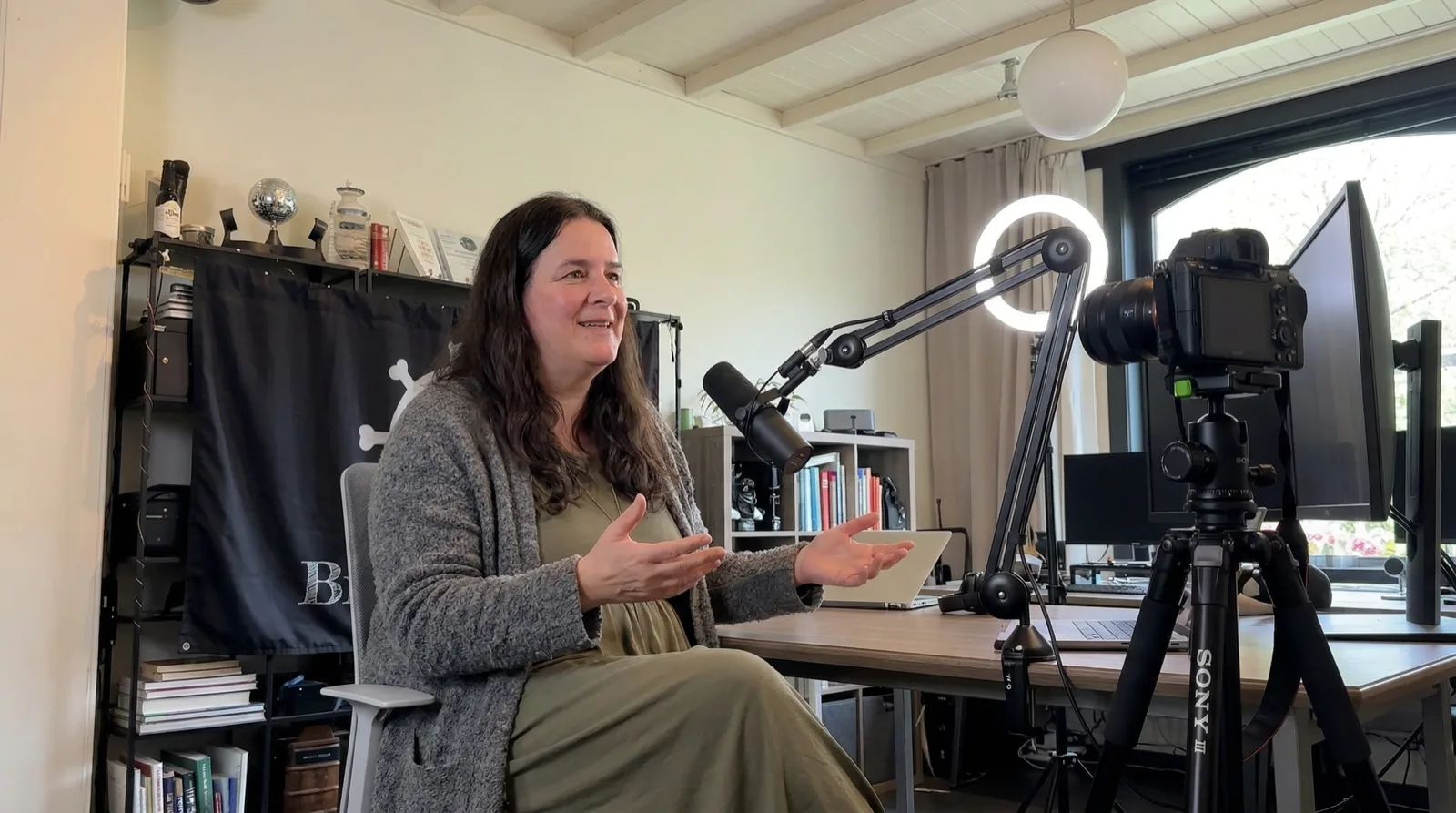 Steff in a podcast recording studio